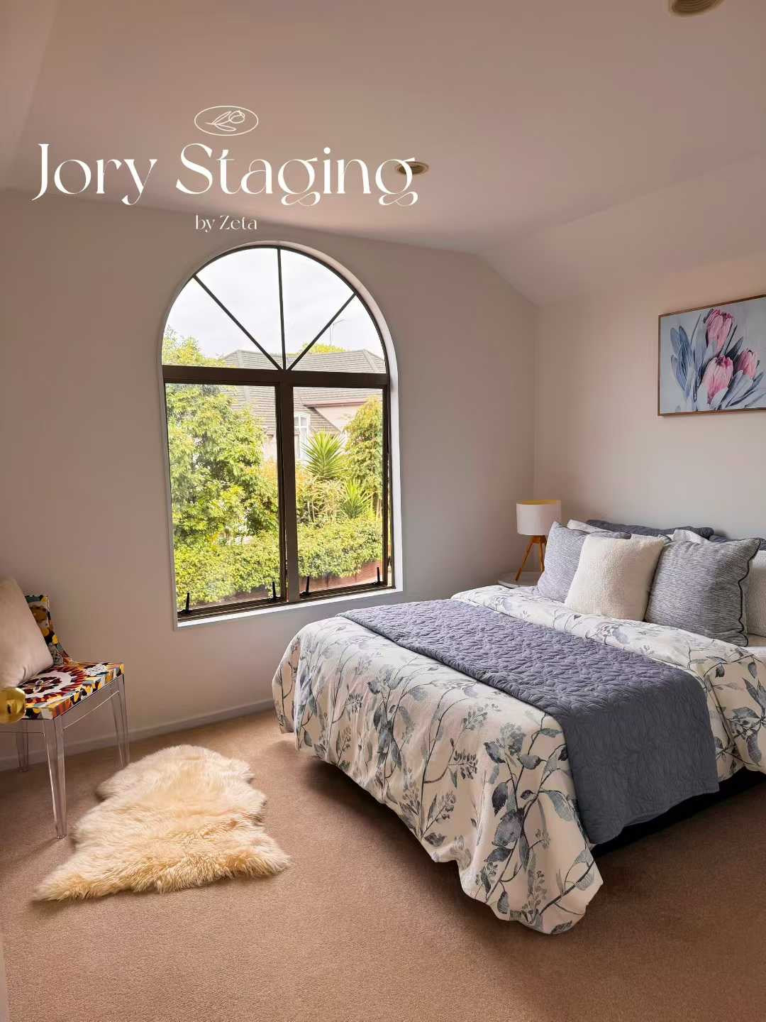Bedroom with arched feature window