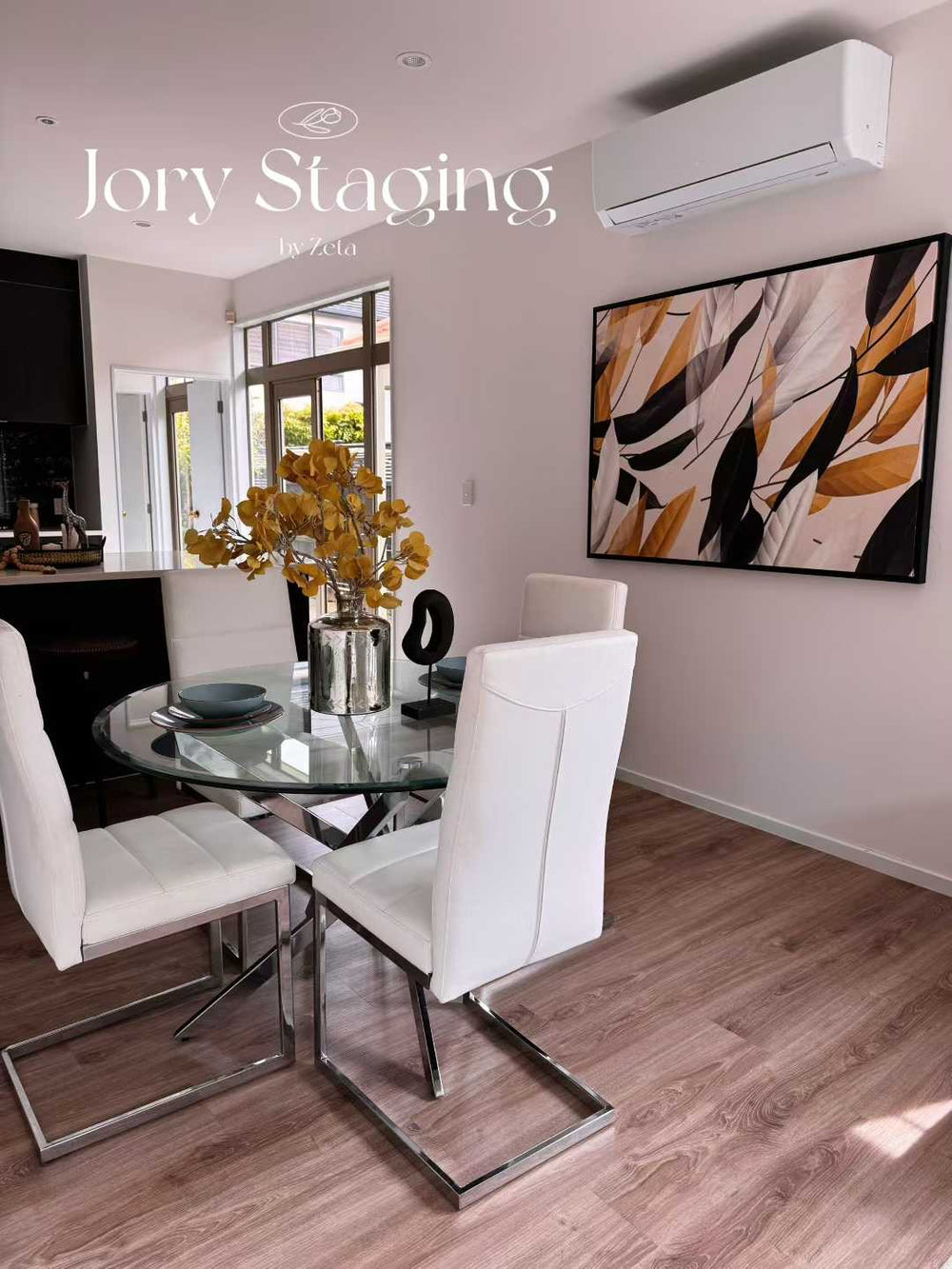 Glass dining table and white chairs