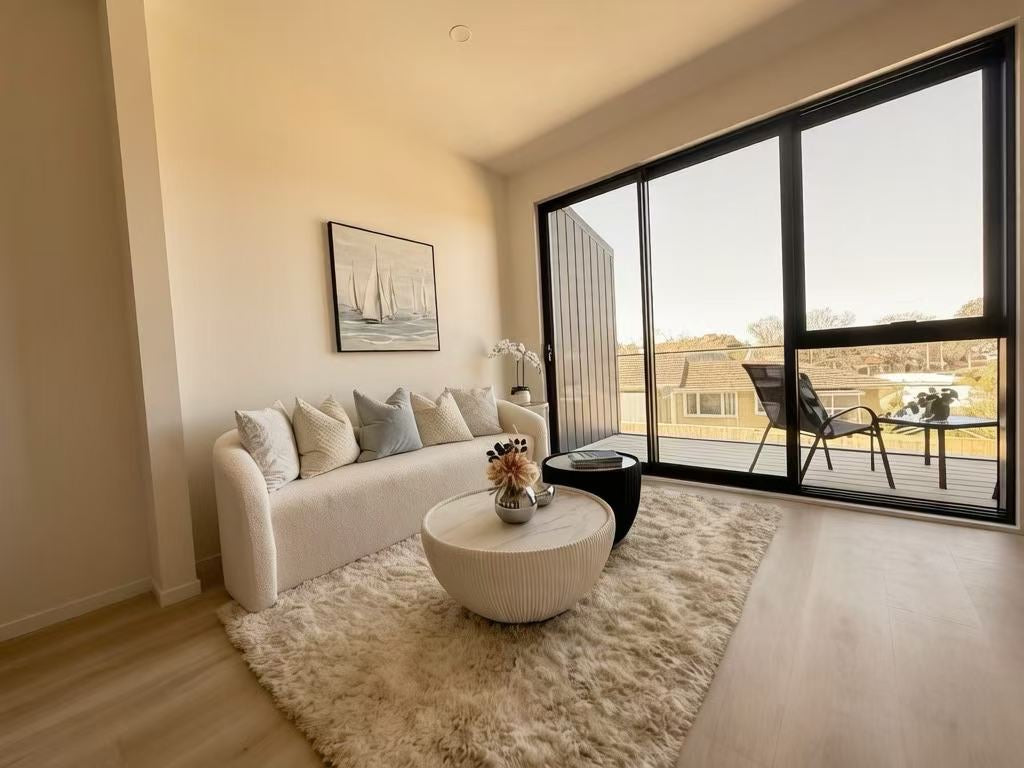 Textured sofa and coffee table near balcony